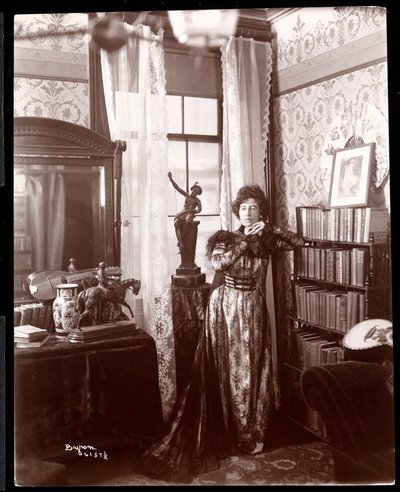Anita Chartres standing in the corner of a room by Byron Company